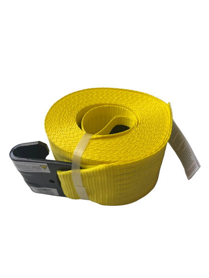 A bright yellow webbed lifting strap with a black metal hook and a white product tag, resting on a white textured surface.