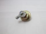 Rotary electrical switch featuring a metal toggle lever and circular gold‑toned mounting base, shown from a zoomed‑out angle on a white background.
