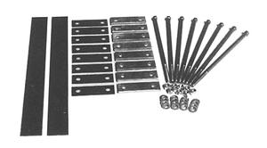 Mounting hardware kit for a truck tool box, including black rubber isolator strips, flat metal mounting plates, long hex bolts, washers, and lock nuts, neatly arranged on a white background.
