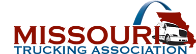 Missouri Trucking Association logo featuring red and blue stylized text with a graphic of a semi-truck and roadway design on a white background.
